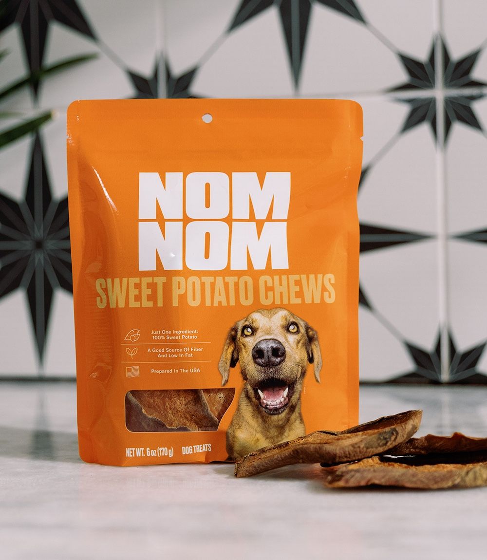 Some Sweet Potato Chews spread out in front of their packaging