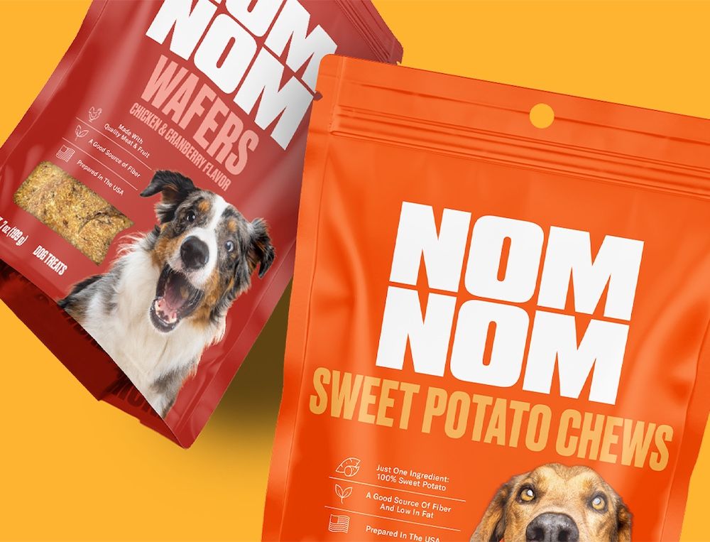 Packages of Nom Nom Sweet Potato Chews and Chicken & Cranberry Wafers